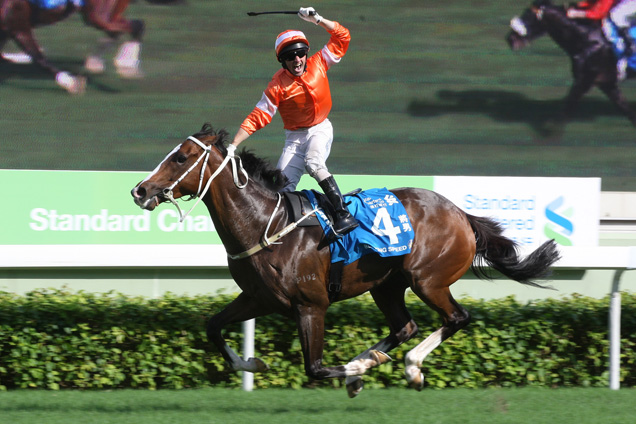 Neil Callan celebrates his victory aboard Blazing Speed in the 2014 edition of the Standard Chartered Champions & Chater Cup.