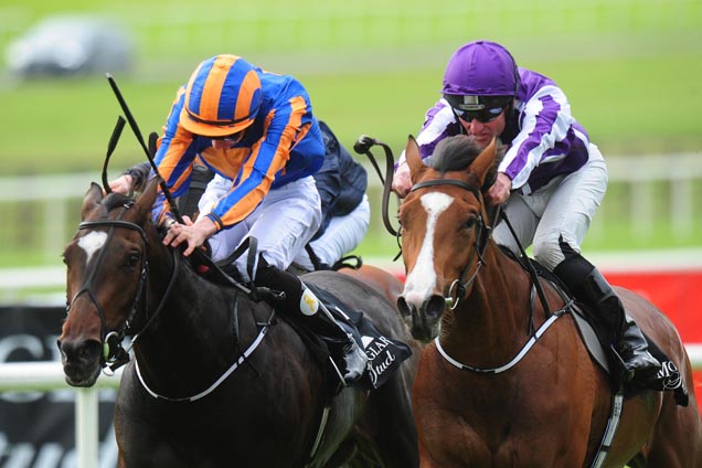 Minding (purple) win the Group 1 Moyglare Stud Stakes from stable companion Ballydoyle