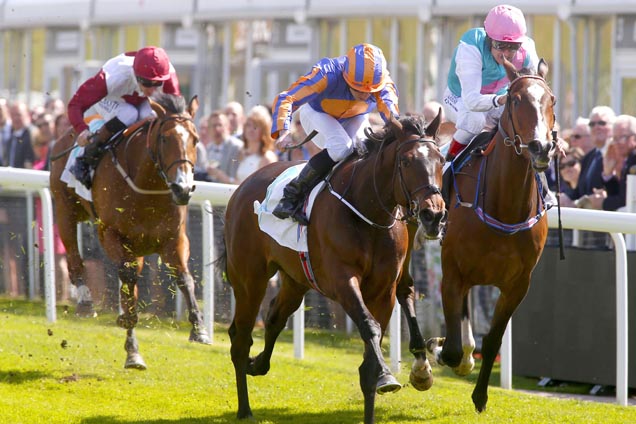 Somehow( blue and orange) winning the Arkle Finance Cheshire Oaks (Fillies' Listed) (For The Robert Sangster Memorial Cup)