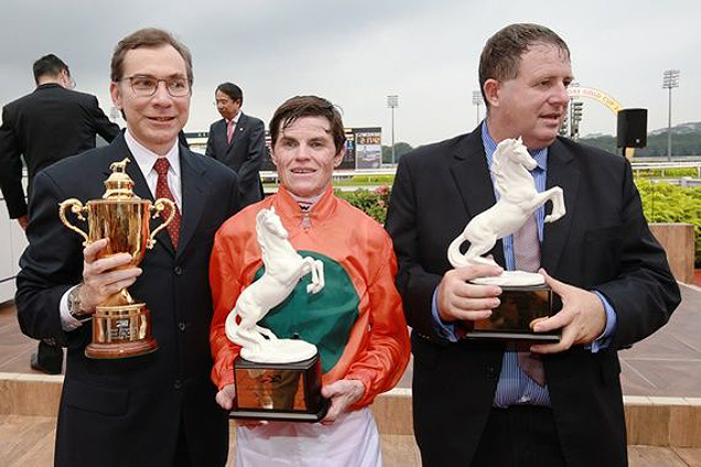 Owner Untung Joesoef(R), jockey Craig Williams and trainer Stephen Gray celebrate their Dester Singapore Gold Cup win with Bahana.