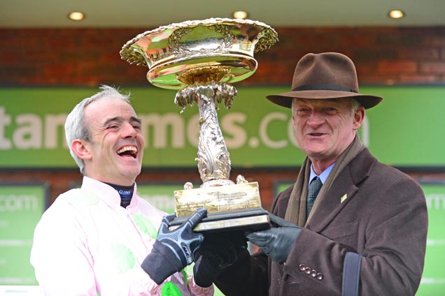 Trainer Willie Mullins and Ruby Walsh pose for the cameras after Annie Power won the Stan James Champion Hurdle