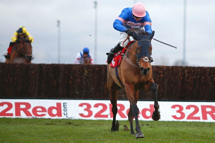 CYRNAME winning the 32Red.com Wayward Lad Novices' Steeple Chase at Kempton Park in United Kingdom.