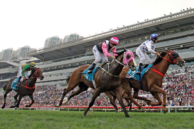 Contentment (No. 3), trained by John Size and ridden by Brett Prebble, wins the Group 1 Champions Mile at Sha Tin Racecourse today.
