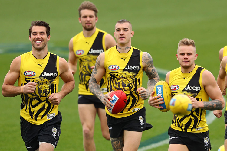 ALEX RANCE, DUSTIN MARTIN and BRANDON ELLIS of the Tigers run during a Richmond Tigers AFL training session at Punt Road Oval in Melbourne, Australia.
