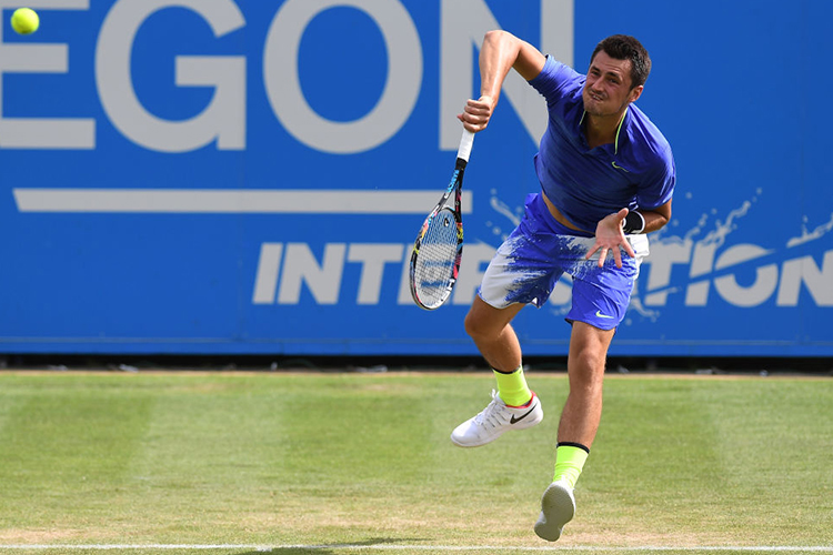 BERNARD TOMIC of Australia serves during the men's singles quarter final match of the Aegon International Eastbourne at Devonshire Park Lawn Tennis Club in Eastbourne, England. BERNARD TOMIC of Australia serves during the men's singles quarter final match of the Aegon International Eastbourne at Devonshire Park Lawn Tennis Club in Eastbourne, England.