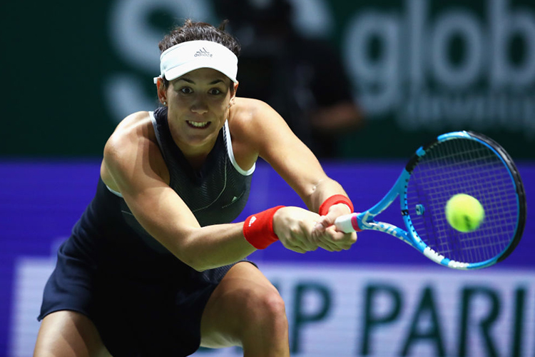 GARBINE MUGURUZA of Spain plays a backhand during the BNP Paribas WTA Finals Singapore presented by SC Global at Singapore Sports Hub in Singapore.