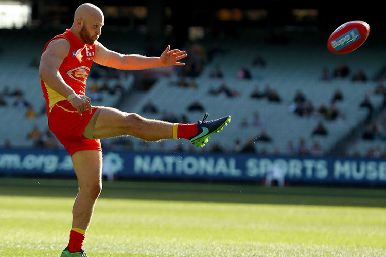 GARY ABLETT of the Suns kicks on goal during the AFL match between the Hawthorn Hawks and the Gold Coast Suns at MCG in Melbourne, Australia.