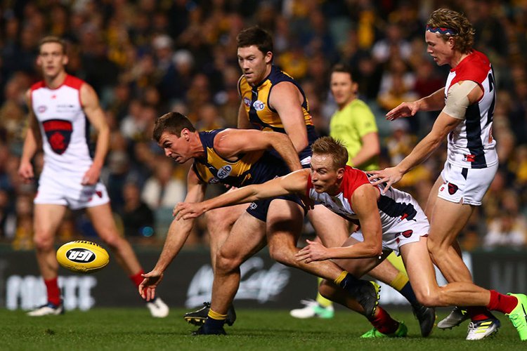 JAMIE CRIPPS of the Eagles and BERNIE VINCE of the Demons contest for the ball during the AFL match between the West Coast Eagles and the Melbourne Demons at Domain Stadium in Perth, Australia.
