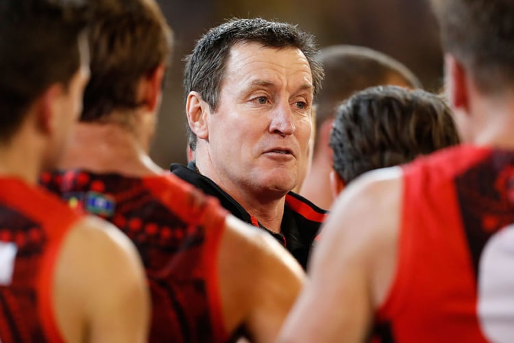 JOHN WORSFOLD, Senior Coach of the Bombers addresses his players during the 2017 AFL match between the Richmond Tigers and the Essendon Bombers at the MCG in Melbourne, Australia.