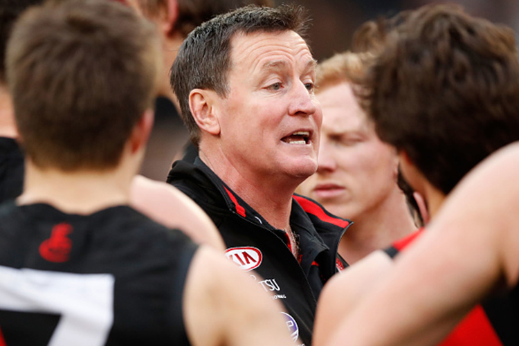 JOHN WORSFOLD, Senior Coach of the Bombers addresses his players during the 2017 AFL match between the Collingwood Magpies and the Essendon Bombers at the MCG in Melbourne, Australia.