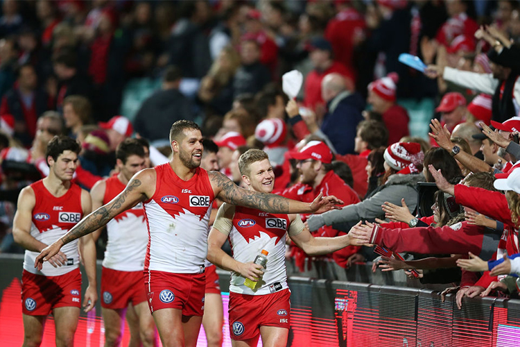 LANCE FRANKLIN of the Swans celebrates with fans after the AFL match between the Sydney Swans and the Essendon Bombers at SCG in Sydney, Australia.