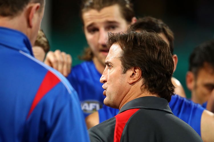 Bulldogs coach LUKE BEVERIDGE talks to players during the AFL match between the Sydney Swans and the Western Bulldogs at SCG in Sydney, Australia.