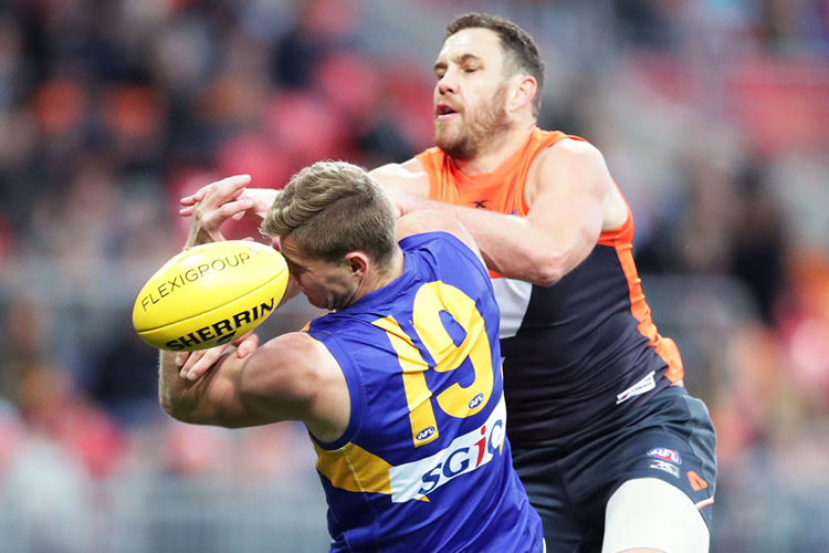 NATHAN VARDY of the Eagles is challenged by SHANE MUMFORD of the Giants during the AFL match between the Greater Western Sydney Giants and the West Coast Eagles at Spotless Stadium in Sydney, Australia.