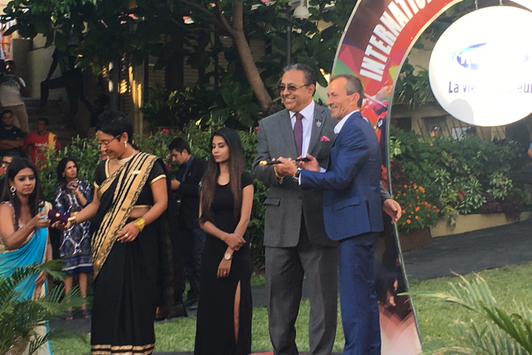 Robbie Fradd receiving his gold-studded whip from Mauritius Turf Club Chairman Mukesh Balgobin. Robbie Fradd receiving his gold-studded whip from Mauritius Turf Club Chairman Mukesh Balgobin.