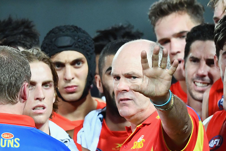Suns head coach RODNEY EADE talks to his players during the AFL match between the Western Bulldogs and the Gold Coast Suns at Cazaly's Stadium in Cairns, Australia.