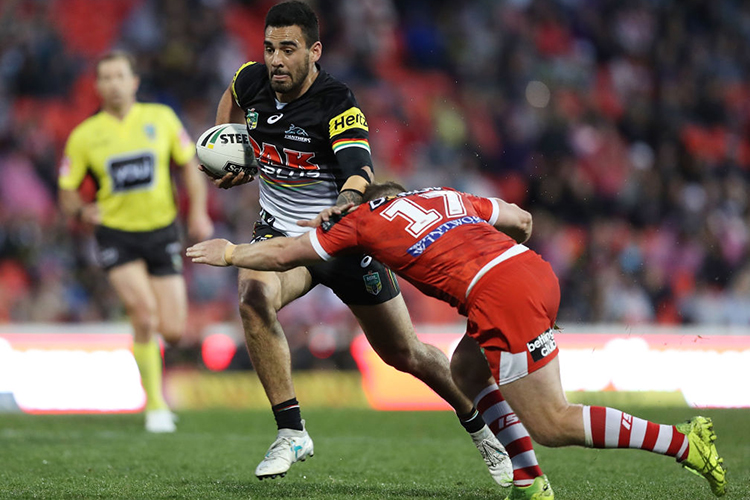 TYRONE MAY of the Panthers is tackled by Josh McCrone of the Dragons during the NRL match between the Penrith Panthers and the St George Illawarra Dragons at Pepper Stadium in Sydney, Australia.