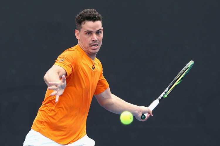 ALEX BOLT of Australia competes against Bernard Nkomba of Australia in the Australian Open match at Melbourne Park in Australia.