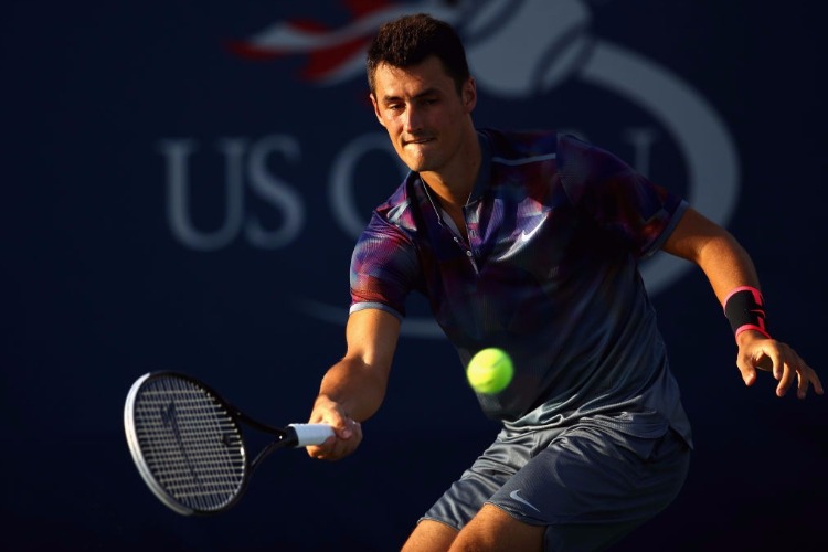 BERNARD TOMIC of Australia returns a shot during a match of the 2017 US Open at the USTA Billie Jean King National Tennis Center in New York City