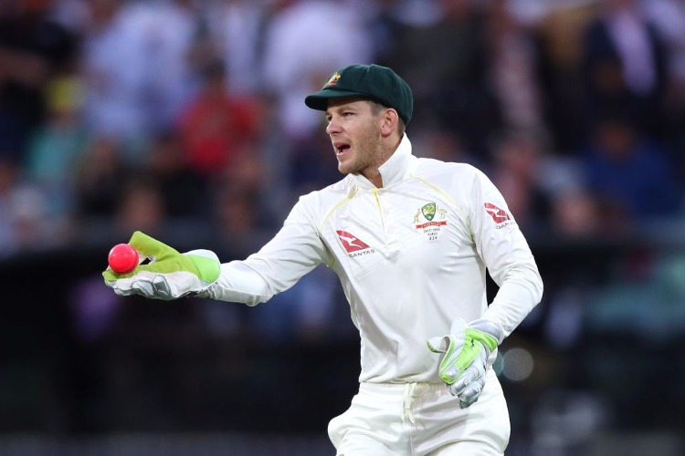 TIM PAINE of Australia passes the ball during a Test match of the 2017/18 Ashes Series at Adelaide Oval in Adelaide, Australia.