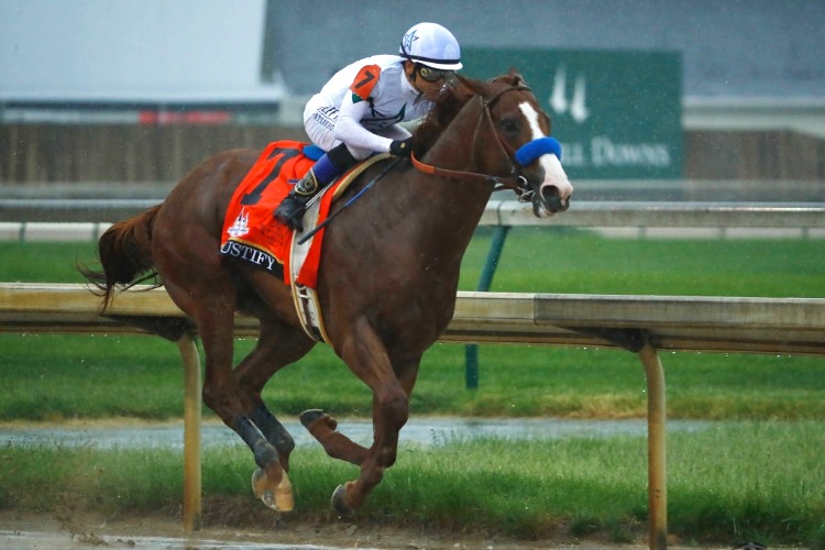 JUSTIFY winning the Kentucky Derby Presented By Woodford Reserve Race at Churchill Downs in Kentucky.