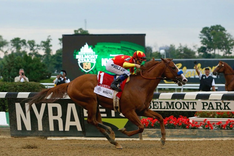 JUSTIFY winning the Belmont Stakes Presented By Nyra Bets Race at Belmont Park in New York.