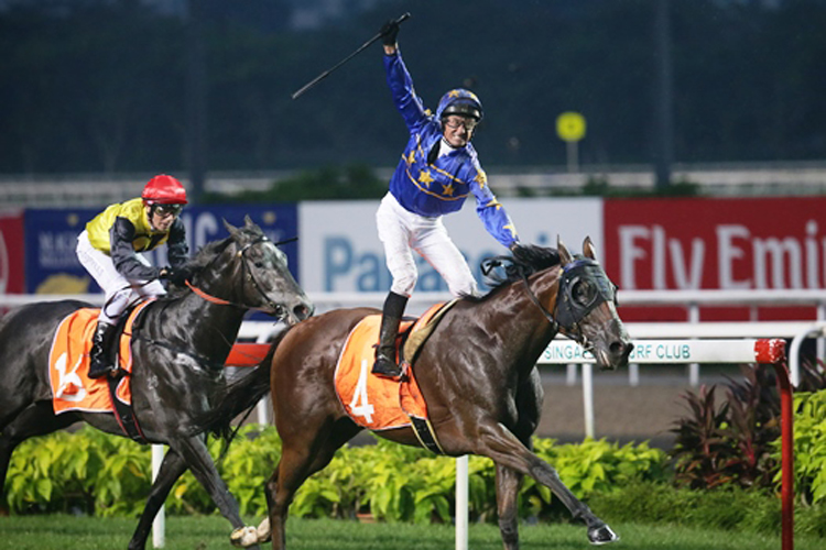 Glen Boss raises his arm in delight as Lim's Cruiser comes out tops in the Lion City Cup.