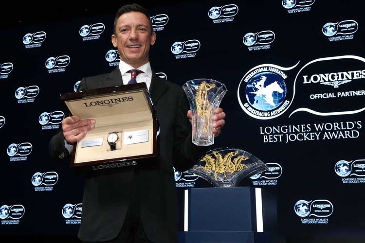 Frankie Dettori poses with the trophy and his Longines watch after the LONGINES Worlds Best Jockey Award ceremony.