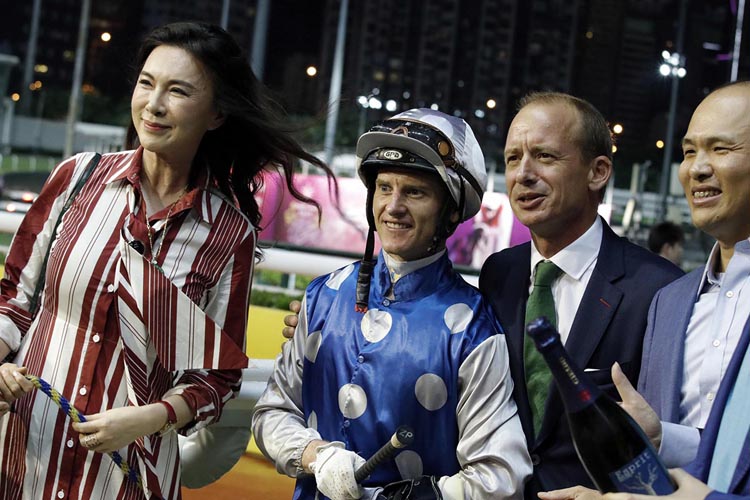 Trainer Richard Gibson and jockey Zac Purton celebrate with the owners of Right Honourable Trainer Richard Gibson and jockey Zac Purton celebrate with the owners of Right Honourable