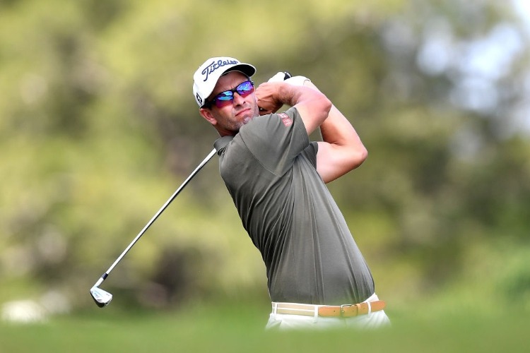 ADAM SCOTT of Australia plays a shot during the Australian PGA Championship at Royal Pines Resort in Gold Coast, Australia. Photo by Bradley Kanaris/Getty Images