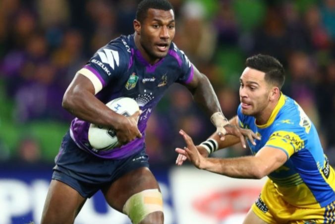 SULIASI VUNIVALU of the Storm runs with the ball during the NRL match between the Melbourne Storm and the Parramatta Eels at AAMI Park in Melbourne, Australia.