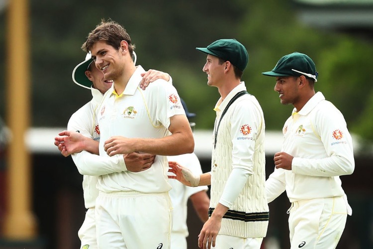 AARON HARDIE of CA XI celebrates with team mates after taking the wicket of Virat Kohli of India during the four day International Tour Match between the Cricket Australia XI and India at SCG in Sydney, Australia