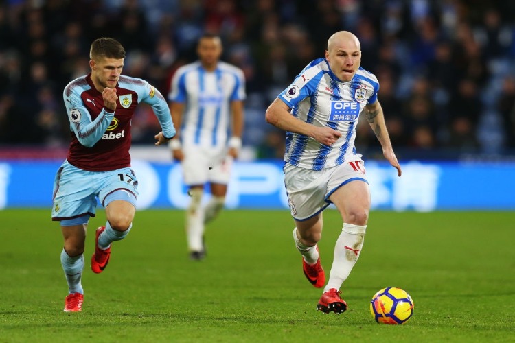 AARON MOOY of Huddersfield Town during the Premier League match between Huddersfield Town and Burnley at John Smith's Stadium in Huddersfield, England. AARON MOOY of Huddersfield Town during the Premier League match between Huddersfield Town and Burnley at John Smith's Stadium in Huddersfield, England.