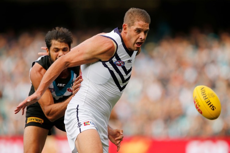 PADDY RYDER of the Power tackles AARON SANDILANDS of the Dockers during the 2017 AFL match between the Port Adelaide Power and the Fremantle Dockers at Adelaide Oval in Adelaide, Australia.