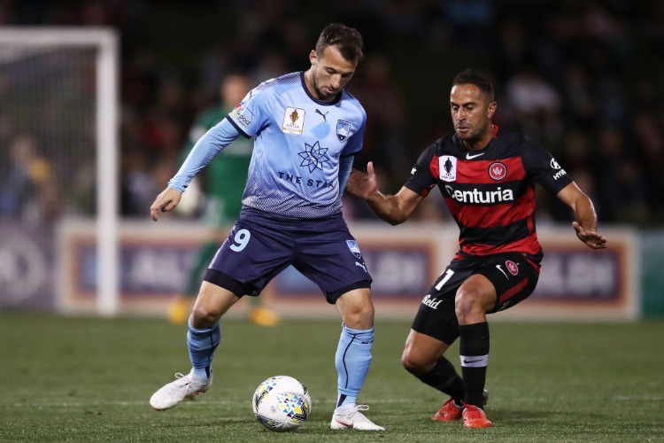 ADAM LE FONDRE of Sydney FC is challenged by Tarek Elrich of the Wanderers during the FFA Cup match between the Western Sydney Wanderers and Sydney FC at Panthers Stadium on in Penrith, Australia