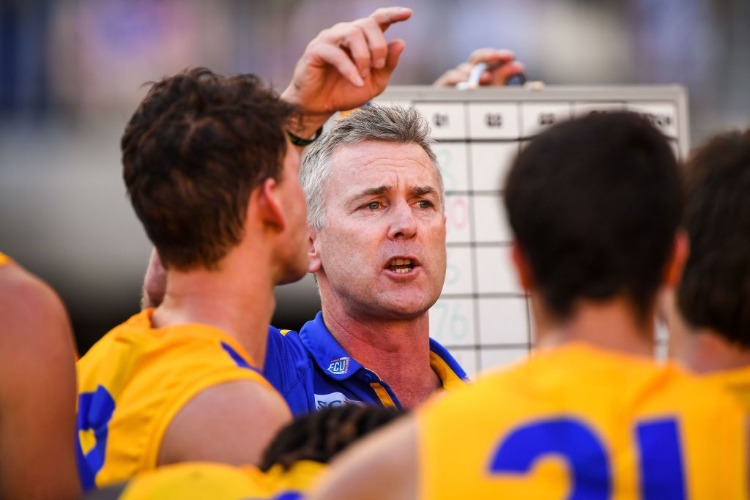 ADAM SIMPSON, coach of the Eagles addresses the team at quarter time during the 2018 AFL match between the Fremantle Dockers and the West Coast Eagles at Optus Stadium in Perth, Australia.