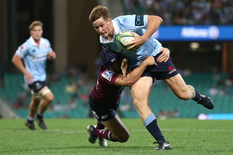 ALEX NEWSOME of the Waratahs is tackled by the Reds defence during the Super Rugby match between the Waratahs and the Reds at SCG in Sydney, Australia. ALEX NEWSOME of the Waratahs is tackled by the Reds defence during the Super Rugby match between the Waratahs and the Reds at SCG in Sydney, Australia.