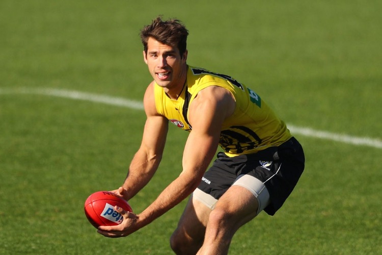 ALEX RANCE of the Tigers runs with the ball during a Richmond Tigers AFL training session at ME Bank Centre in Melbourne, Australia.