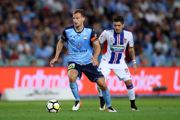 ALEX WILKINSON of Sydney FC dribbles the ball during the A-League match between Sydney FC and the Newcastle Jets at Allianz Stadium in Sydney, Australia.
