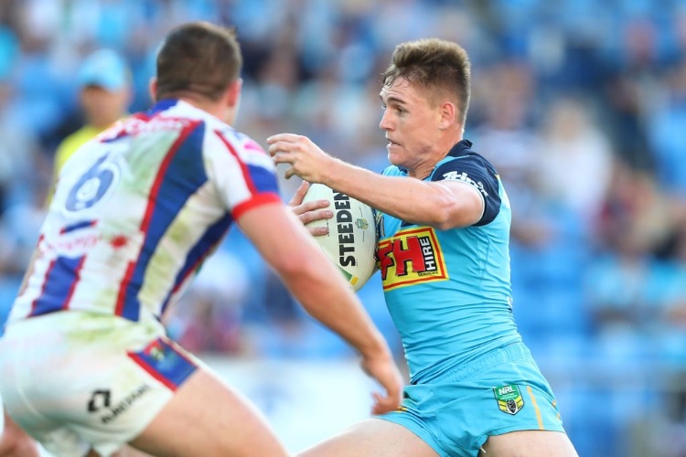 ALEXANDER BRIMSON of the Titans runs the ball during the NRL match between the Gold Coast Titans and the Newcastle Knights at Cbus Super Stadium in Gold Coast, Australia.
