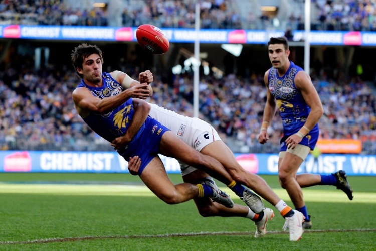 ANDREW GAFF of the Eagles handpasses the ball under pressure during the AFL match between the West Coast Eagles and the Greater Western Sydney Giants at Optus Stadium in Perth, Australia. ANDREW GAFF of the Eagles handpasses the ball under pressure during the AFL match between the West Coast Eagles and the Greater Western Sydney Giants at Optus Stadium in Perth, Australia.