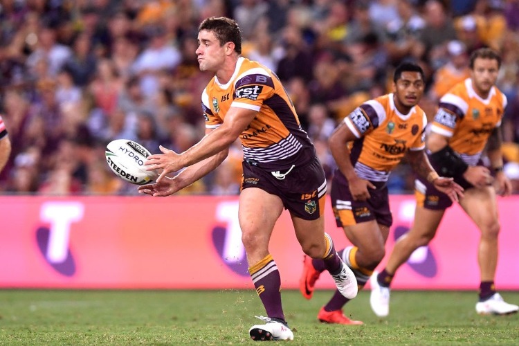 ANDREW MCCULLOUGH of the Broncos passes the ball during the NRL match between the Brisbane Broncos and the North Queensland Cowboys at Suncorp Stadium in Brisbane, Australia.