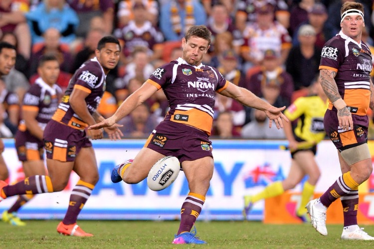 ANDREW MCCULLOUGH of the Broncos kicks the ball during the NRL match between the Brisbane Broncos and the Sydney Roosters at Suncorp Stadium in Brisbane, Australia.
