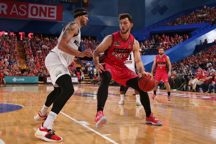 ANGUS BRANDT of the Wildcats works to the basket against Josh Boone of United during the NBL match between the Perth Wildcats and Melbourne United at RAC Arena in Perth, Australia. ANGUS BRANDT of the Wildcats works to the basket against Josh Boone of United during the NBL match between the Perth Wildcats and Melbourne United at RAC Arena in Perth, Australia.