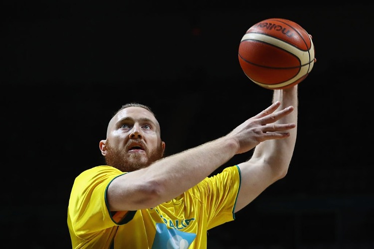 ARON BAYNES of the Boomers warms up prior to the match between the Australian Boomers and the Pac-12 College All-stars at Hisense Arena in Melbourne, Australia.