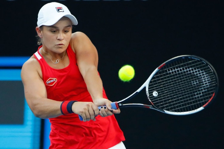 ASHLEIGH BARTY of Australia plays a backhand against Camila Giorgi of Italy of the 2018 Australian Open at Melbourne Park in Australia.