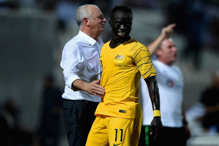 AWER MABIL of Australia celebrates with his coach Graham Arnold scoring his sides fourth goal during the International Friendly match between Kuwait and Australia at Al Kuwait Sports Club Stadium in Kuwait City, Kuwait.