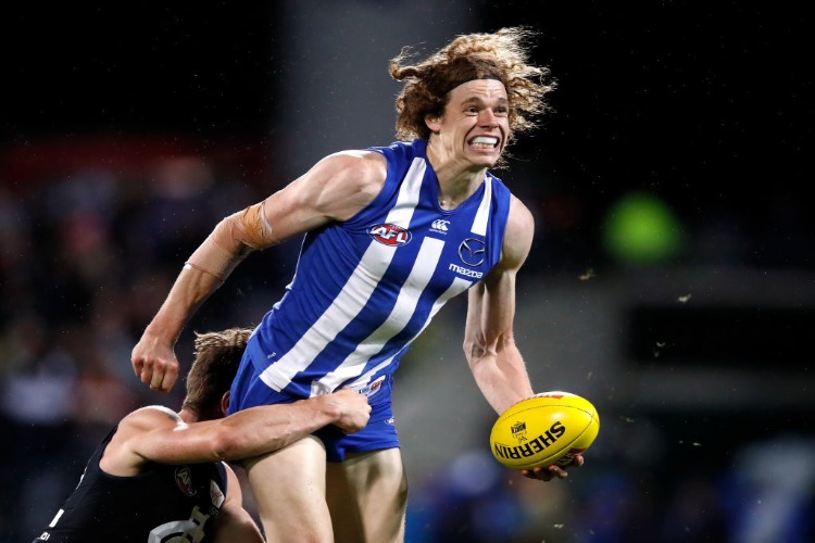 BEN BROWN of the Kangaroos is tackled by Nick Graham of the Blues during the 2018 AFL match between the North Melbourne Kangaroos and the Carlton Blues at Blundstone Arena in Hobart, Australia.