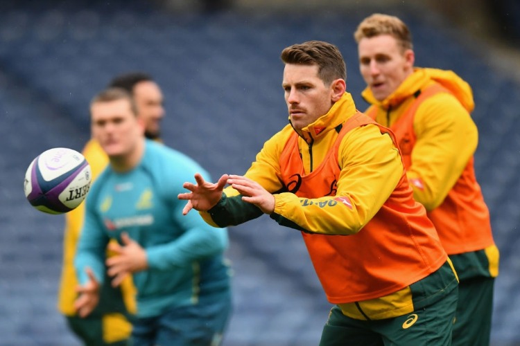 BERNARD FOLEY of Australia passes the ball during the Australia Captain's Run at Murrayfield Stadium in Edinburgh, Scotland.