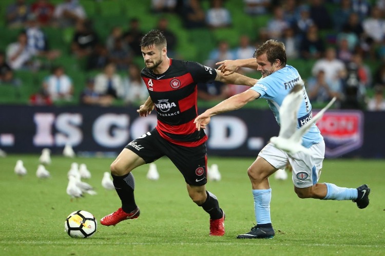 BRENDAN HAMILL of the Wanderers is challenged by NICK FITZGERALD of the City during the A-League match between Melbourne City and the Western Sydney Wanderers at AAMI Park in Melbourne, Australia. BRENDAN HAMILL of the Wanderers is challenged by NICK FITZGERALD of the City during the A-League match between Melbourne City and the Western Sydney Wanderers at AAMI Park in Melbourne, Australia.