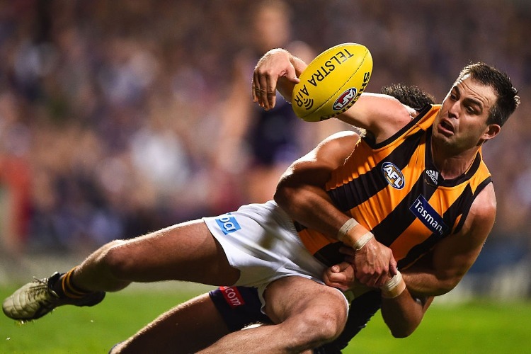 BRIAN LAKE of the Hawthorn Hawks is tackled during the AFL First Preliminary Final match between the Fremantle Dockers and the Hawthorn Hawks at Domain Stadium, Perth, Australia BRIAN LAKE of the Hawthorn Hawks is tackled during the AFL First Preliminary Final match between the Fremantle Dockers and the Hawthorn Hawks at Domain Stadium, Perth, Australia